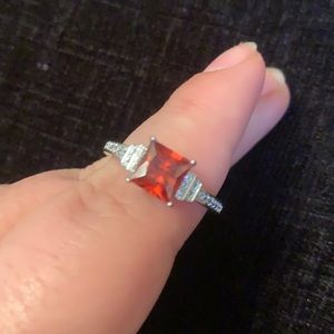 White metal band with orange stone